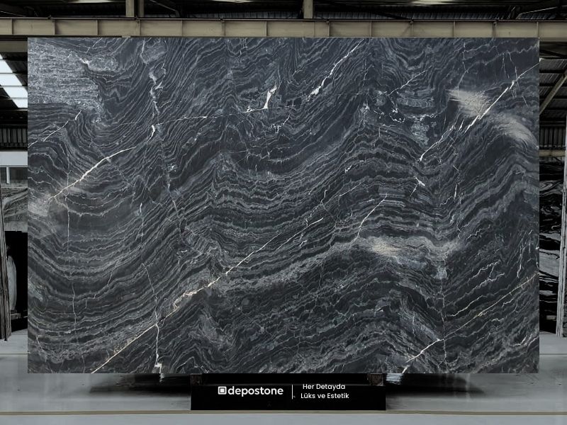 Vision Black: Remarkable polished marble slab with flowing white and silver veining for elite design.